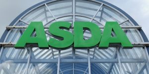 ASDA supermarket entrance with grey skies looming behind