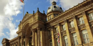 Birmingham Council building under a blue sky, representing the landmark Birmingham equal pay settlement addressing pay disparities for council staff.