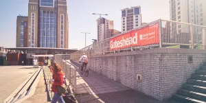 Gateshead city scene with a council banner – find out how to claim Gateshead data breach compensation.