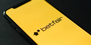 phone with a logo of bettfair on display