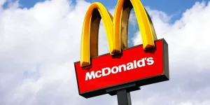 McDonalds logo on blue sky background