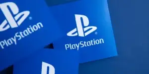 Sony playstation logo against a blue background. Playstation is a video game brand