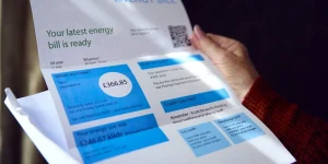 Close Up Of Woman Opening UK Energy Bill Concerned About Cost Of Living Energy Crisis