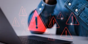 Data breach. Spam virus with warning caution for notification on internet security protect. Person use laptop system hacked warning sign on virtual screen.