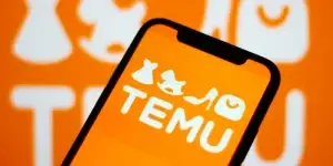 logo of Temu ecommerce is displayed on a smartphone.